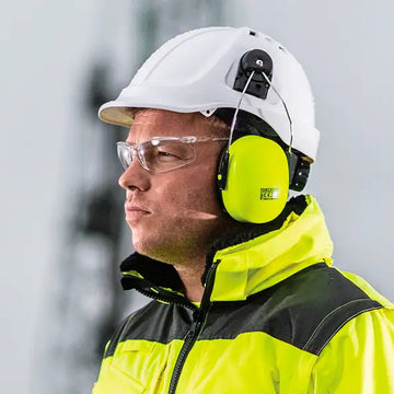 Bright yellow kess ear defenders with black accents, worn over a white hard hat.