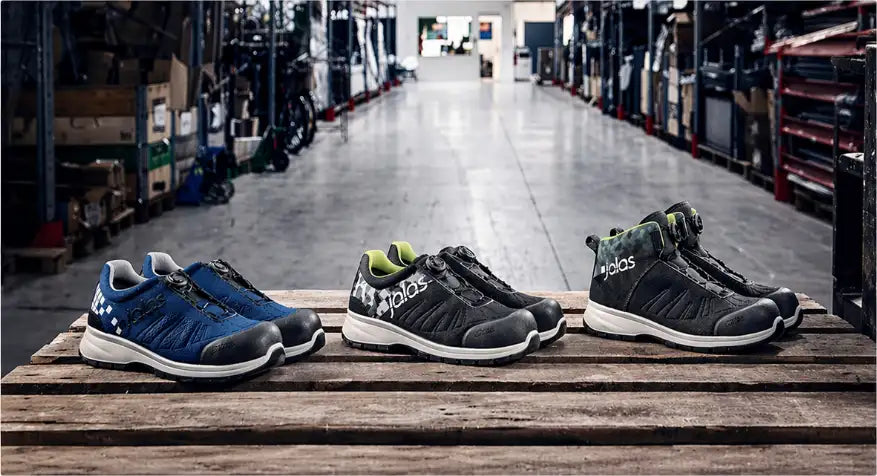 Black and green adidas work boots with a rugged, durable design.slider_item_YeJA6M